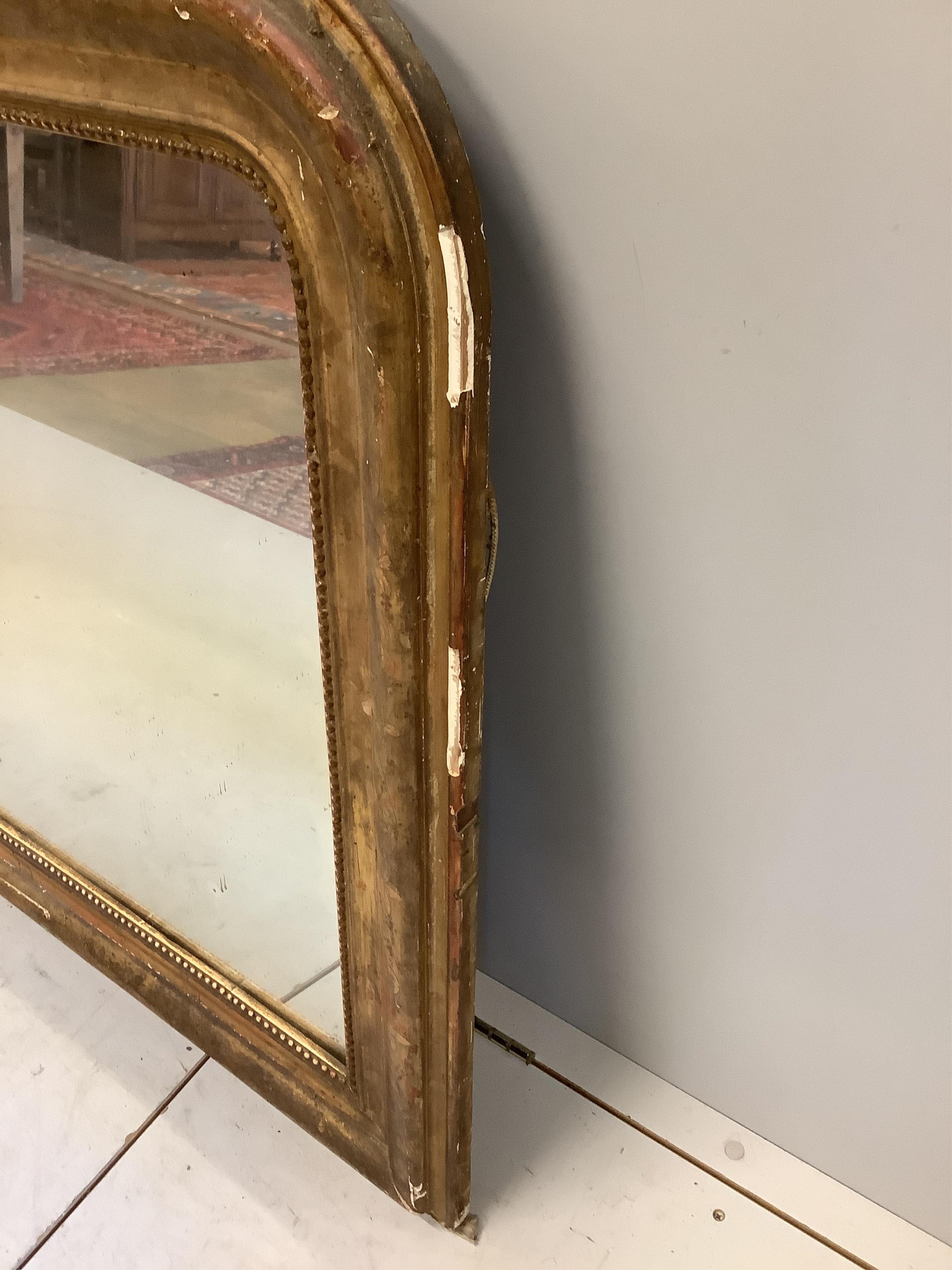 A late 19th century French giltwood and gesso overmantel mirror, width 144cm, height 90cm. Condition - poor, losses around frame and cracking